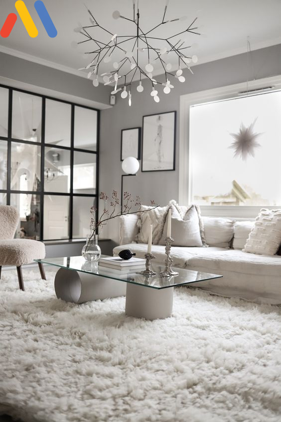 Đặc trưng không thể thiếu của phong cách thiết kế nội thất phòng khách chung cư chính là thảm lông