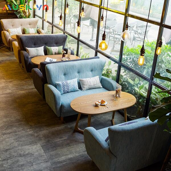 Quán cafe hiện đại nổi bật với ghế sofa nỉ xanh